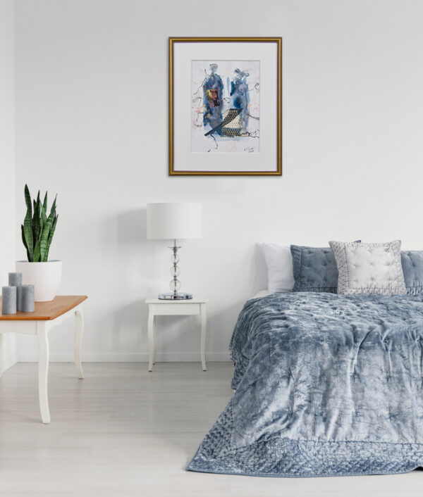 Modern minimalist bedroom with blue-gray bedding, artwork, potted plant, and stylish decor.