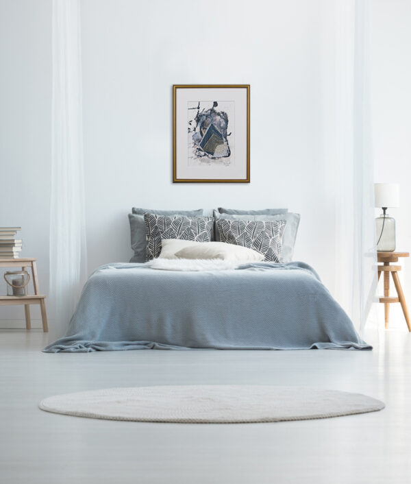 Modern minimalist bedroom with blue bedding, abstract artwork, wooden furniture, and cozy decor.