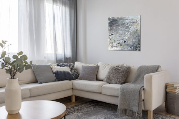 Beige Comfortable Corner Sofa With Grey Pillows In Elegant Living Room Interior With White Wall